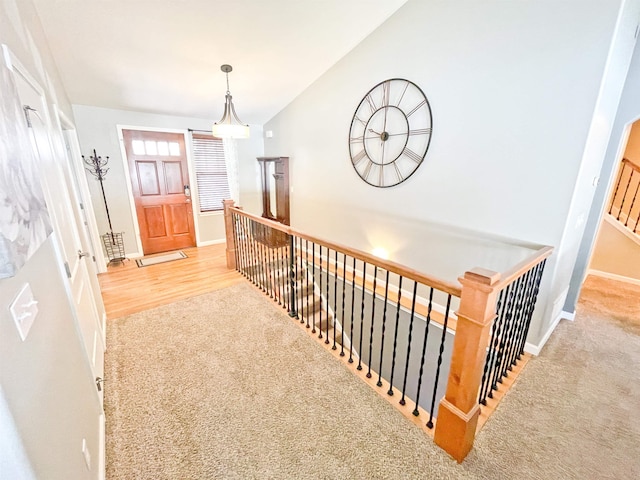 1602 S Canyon Woods Ln, Spokane, WA 99224 - corridor featuring baseboards, lofted ceiling, carpet flooring, and an upstairs landing