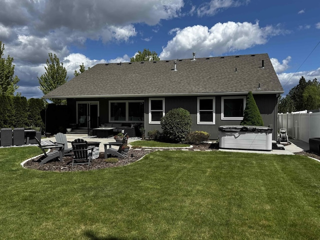 1602 S Canyon Woods Ln, Spokane, WA 99224 - rear view of house with a hot tub, a shingled roof, and a patio