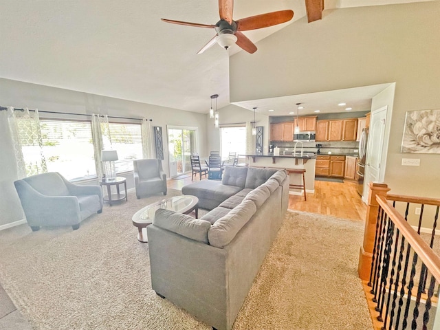 1602 S Canyon Woods Ln, Spokane, WA 99224 - living room with ceiling fan, beam ceiling, high vaulted ceiling, baseboards, and recessed lighting
