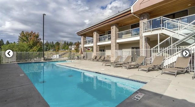 1602 S Canyon Woods Ln, Spokane, WA 99224 - community pool featuring a patio area