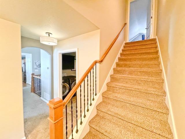 1602 S Canyon Woods Ln, Spokane, WA 99224 - stairway featuring arched walkways and carpet flooring