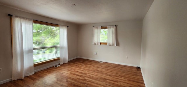 156 W 9th Ave, Colville, WA 99114 - empty room featuring wood finished floors and baseboards
