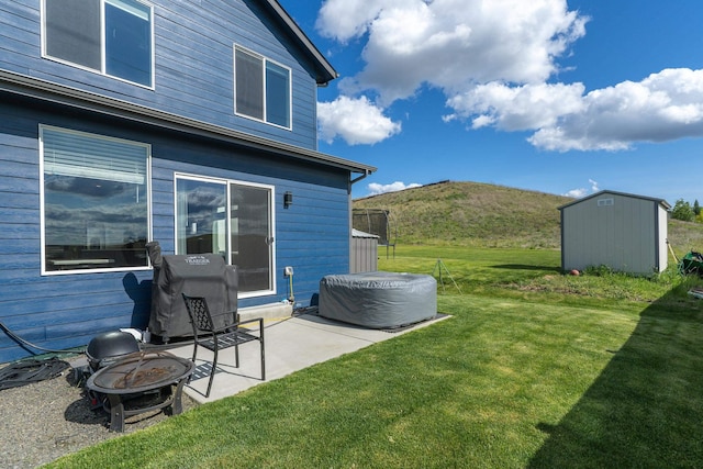 1116 Greenfield Dr, Cheney, WA 99004 - view of grassy yard with a fire pit, a patio area, and a mountain view