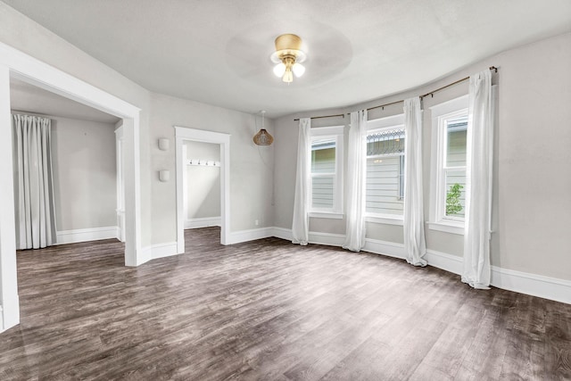 2305 W Sharp Ave, Spokane, WA 99201 - spare room with wood finished floors, a ceiling fan, and baseboards
