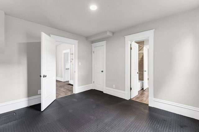 2305 W Sharp Ave, Spokane, WA 99201 - unfurnished bedroom with wood finished floors, baseboards, and recessed lighting