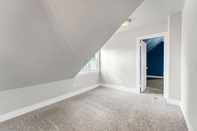 2305 W Sharp Ave, Spokane, WA 99201 - additional living space with carpet flooring, baseboards, and lofted ceiling