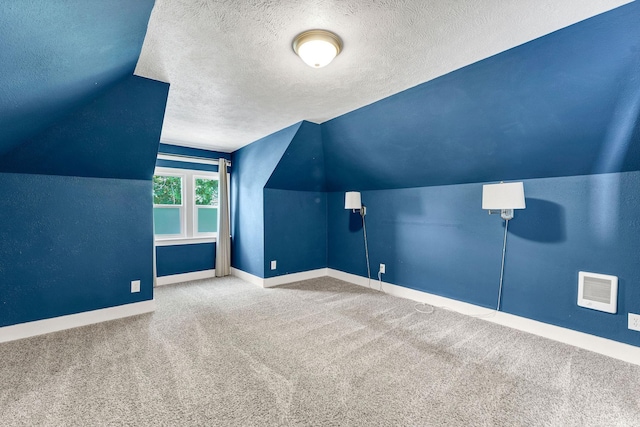 2305 W Sharp Ave, Spokane, WA 99201 - bonus room featuring carpet flooring, a textured ceiling, baseboards, and lofted ceiling