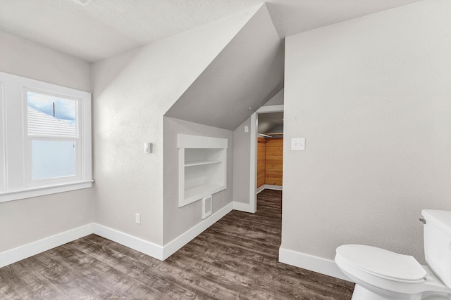 2305 W Sharp Ave, Spokane, WA 99201 - bathroom with baseboards, built in shelves, wood finished floors, toilet, and lofted ceiling