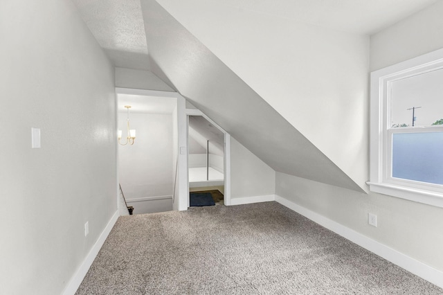 2305 W Sharp Ave, Spokane, WA 99201 - bonus room with carpet, vaulted ceiling, a chandelier, and baseboards