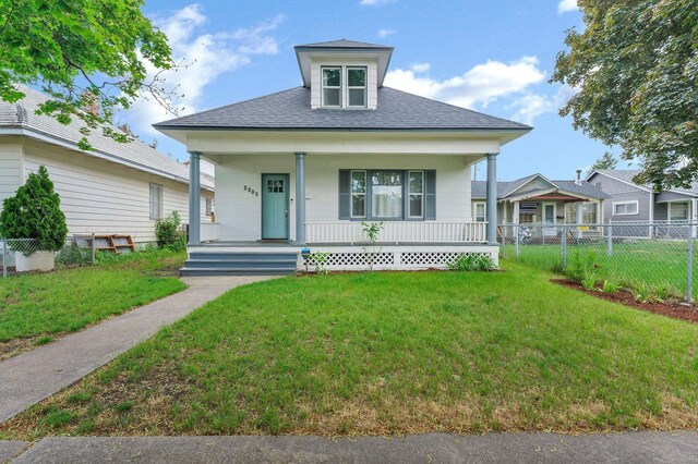 2305 W Sharp Ave, Spokane, WA 99201 - bungalow-style home with covered porch and a shingled roof