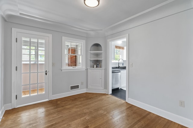 2417 W Euclid Ave, Spokane, WA 99205 - unfurnished dining area with wood finished floors, a sink, healthy amount of natural light, and baseboards