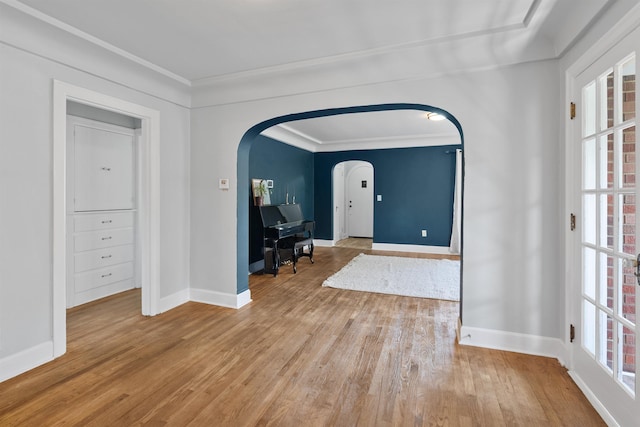 2417 W Euclid Ave, Spokane, WA 99205 - foyer featuring arched walkways, light wood finished floors, ornamental molding, and baseboards