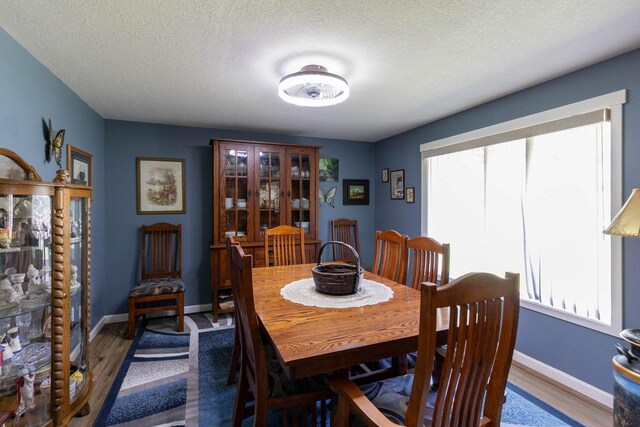 4921 W Londale Ct, Spokane, WA 99208 - bedroom featuring light colored carpet, multiple closets, ceiling fan, and a textured ceiling