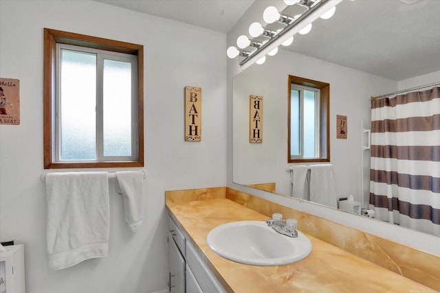 4921 W Londale Ct, Spokane, WA 99208 - bathroom with vanity and curtained shower