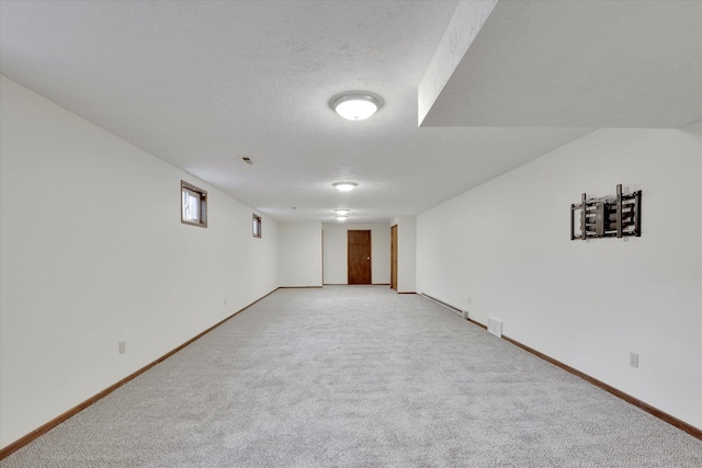 4921 W Londale Ct, Spokane, WA 99208 - unfurnished room featuring light colored carpet, baseboards, and a textured ceiling