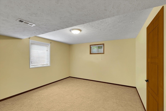 4921 W Londale Ct, Spokane, WA 99208 - below grade area with light colored carpet, a textured ceiling, healthy amount of natural light, and baseboards