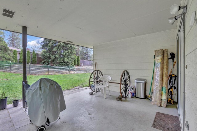 4921 W Londale Ct, Spokane, WA 99208 - view of front facade featuring driveway, an attached garage, roof mounted solar panels, a chimney, and a shingled roof