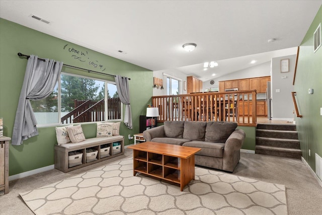 4031 S Bates Rd, Spokane Valley, WA 99206 - living room with carpet flooring, baseboards, vaulted ceiling, and stairway