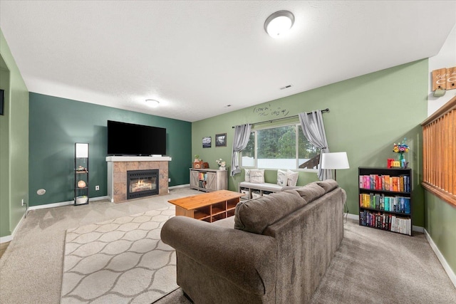 4031 S Bates Rd, Spokane Valley, WA 99206 - carpeted living room featuring baseboards and a tile fireplace