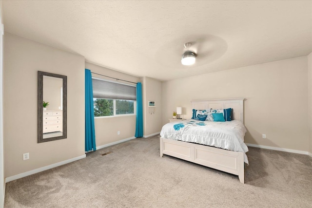 4031 S Bates Rd, Spokane Valley, WA 99206 - bedroom with light carpet, baseboards, and a ceiling fan