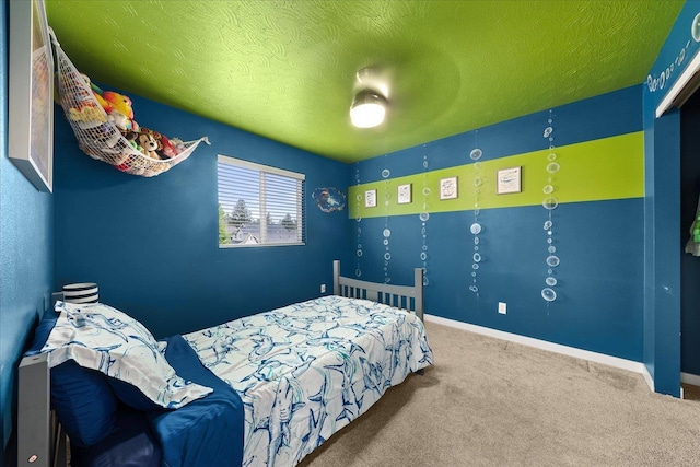 4031 S Bates Rd, Spokane Valley, WA 99206 - bedroom featuring carpet floors, a textured ceiling, and baseboards