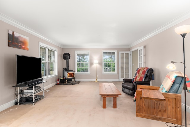 6325 W 48th Ave, Spokane, WA 99224 - living room with carpet floors, ornamental molding, a wood stove, and baseboards