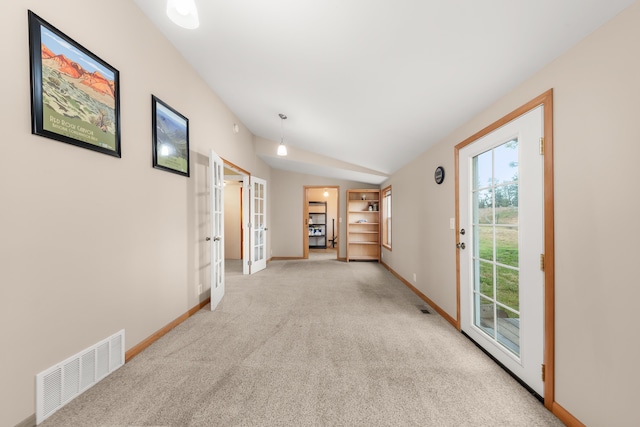 6325 W 48th Ave, Spokane, WA 99224 - hall featuring french doors, light colored carpet, baseboards, and lofted ceiling