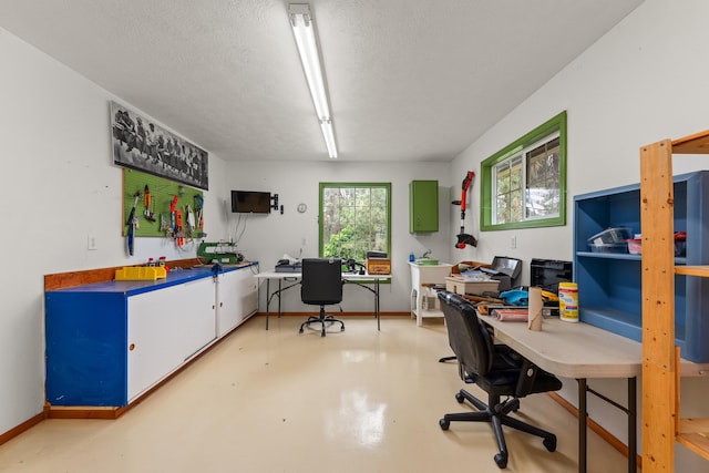6325 W 48th Ave, Spokane, WA 99224 - office featuring finished concrete floors, a textured ceiling, and baseboards
