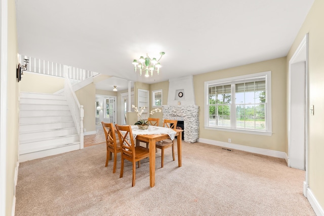 6325 W 48th Ave, Spokane, WA 99224 - dining room with carpet, stairway, a chandelier, and baseboards