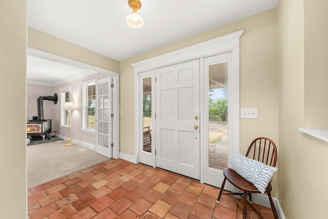 6325 W 48th Ave, Spokane, WA 99224 - carpeted entrance foyer with a wood stove, baseboards, and crown molding