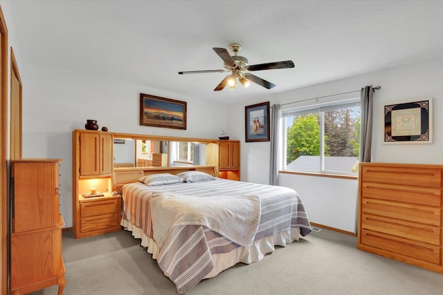 15711 N Unicorn Ct, Mead, WA 99021 - bedroom with light colored carpet and a ceiling fan