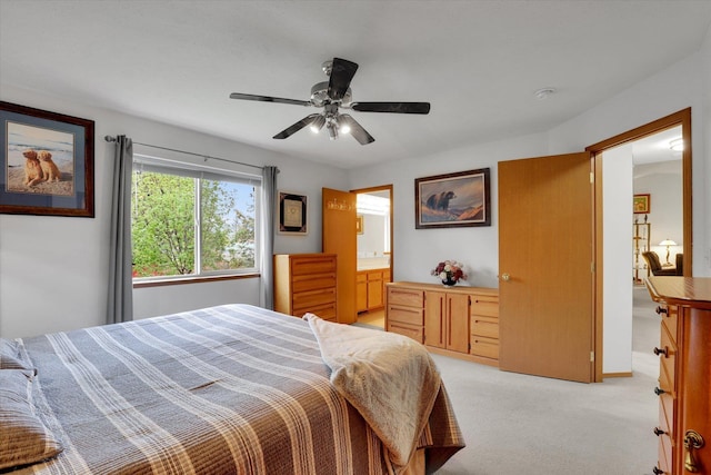 15711 N Unicorn Ct, Mead, WA 99021 - bedroom featuring light colored carpet, ceiling fan, and ensuite bath
