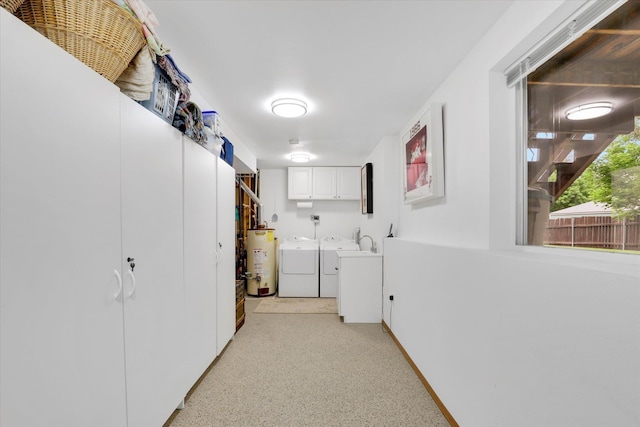 15711 N Unicorn Ct, Mead, WA 99021 - laundry area with washing machine and clothes dryer, water heater, and cabinet space