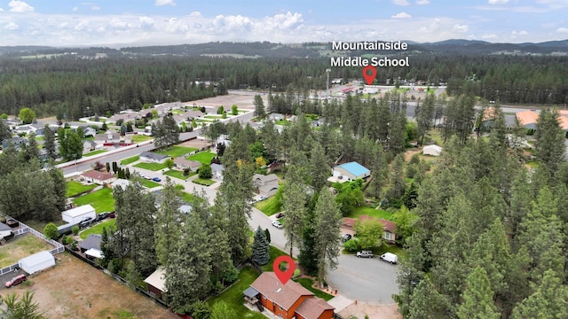 15711 N Unicorn Ct, Mead, WA 99021 - aerial view of property's location featuring a forest and nearby suburban area