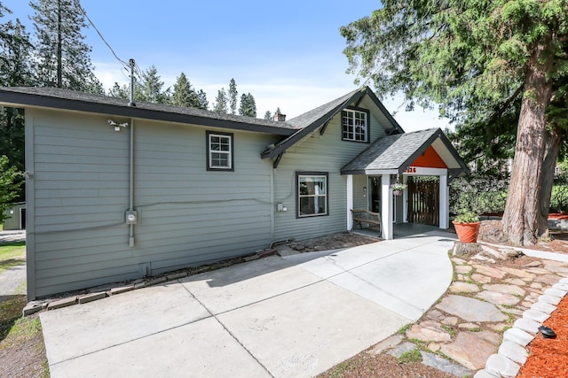 2526 E 8th Ave, Spokane, WA 99202 - rear view of property featuring a patio, a chimney, and concrete driveway