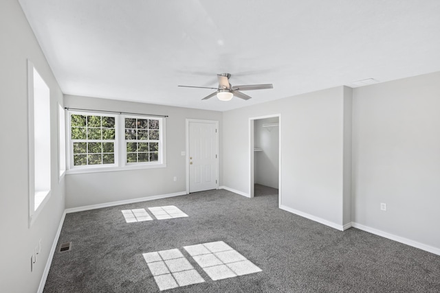 2526 E 8th Ave, Spokane, WA 99202 - unfurnished bedroom featuring carpet, baseboards, ceiling fan, and a spacious closet