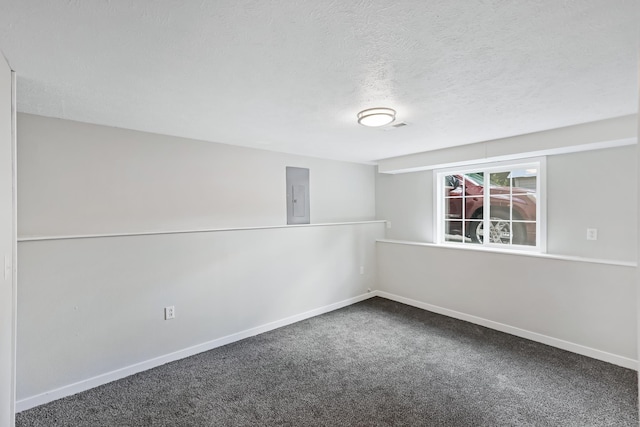 2526 E 8th Ave, Spokane, WA 99202 - spare room with electric panel, carpet floors, baseboards, and a textured ceiling