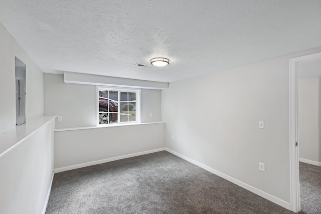 2526 E 8th Ave, Spokane, WA 99202 - carpeted spare room with baseboards, a textured ceiling, and electric panel