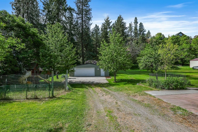 2526 E 8th Ave, Spokane, WA 99202 - obstructed view of property featuring an outbuilding, a garage, and dirt driveway
