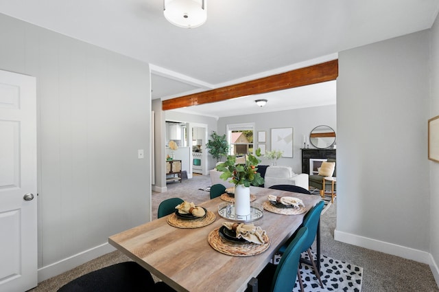 2526 E 8th Ave, Spokane, WA 99202 - carpeted dining space with baseboards and beam ceiling