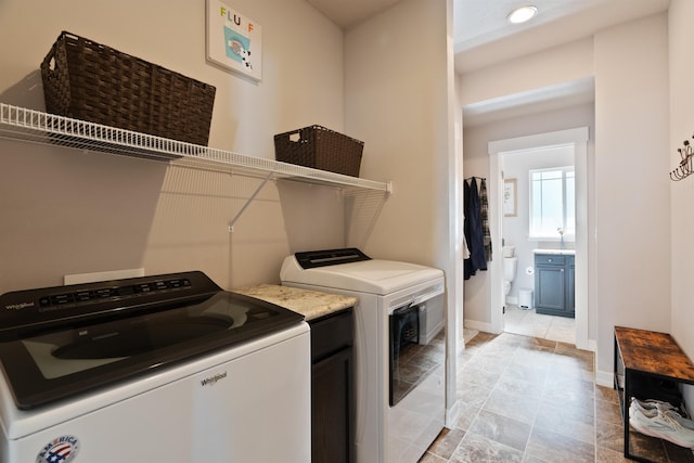 18218 E Michielli Ave, Spokane Valley, WA 99016 - washroom featuring washing machine and clothes dryer, baseboards, recessed lighting, and cabinet space