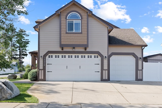 18218 E Michielli Ave, Spokane Valley, WA 99016 - traditional-style house with concrete driveway, roof with shingles, and an attached garage