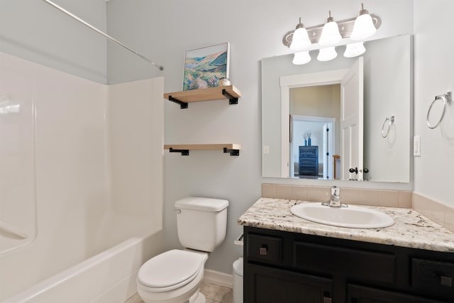 18218 E Michielli Ave, Spokane Valley, WA 99016 - full bathroom with toilet, vanity, bathtub / shower combination, and baseboards