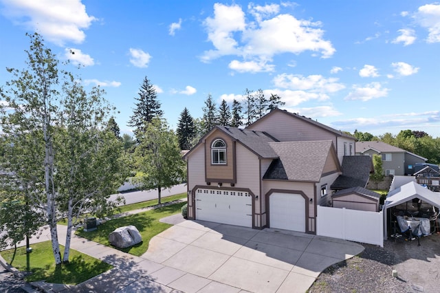 18218 E Michielli Ave, Spokane Valley, WA 99016 - traditional home with driveway, a shingled roof, and a garage