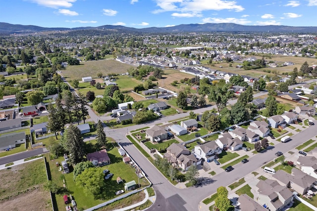 18218 E Michielli Ave, Spokane Valley, WA 99016 - aerial overview of property's location featuring a mountainous background and nearby suburban area