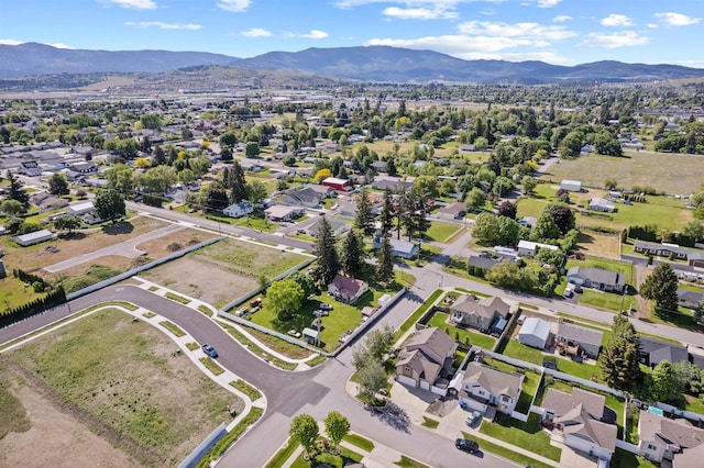 18218 E Michielli Ave, Spokane Valley, WA 99016 - aerial view of property and surrounding area with a mountain backdrop and nearby suburban area