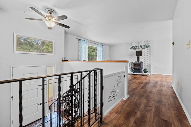 122 E Circle Dr, Newport, WA 99156 - hallway with an upstairs landing, wood finished floors, and baseboards