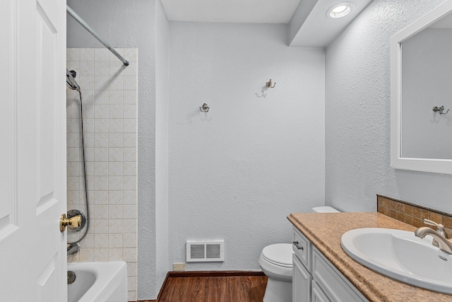 122 E Circle Dr, Newport, WA 99156 - full bath with vanity, toilet, wood finished floors, shower / tub combination, and a textured wall
