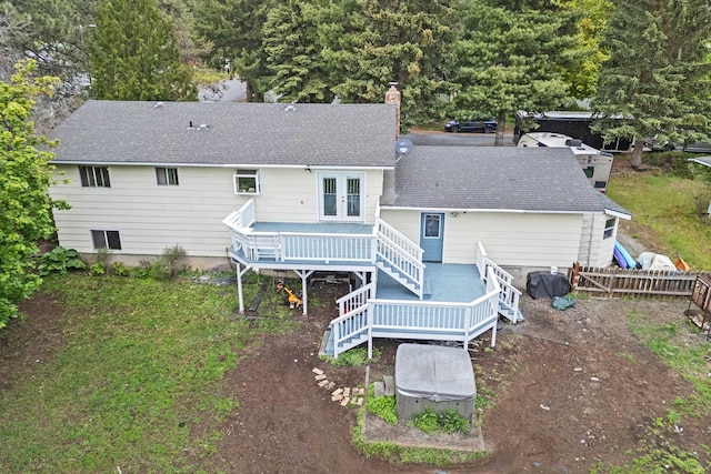 122 E Circle Dr, Newport, WA 99156 - rear view of property with a deck, roof with shingles, french doors, and a chimney