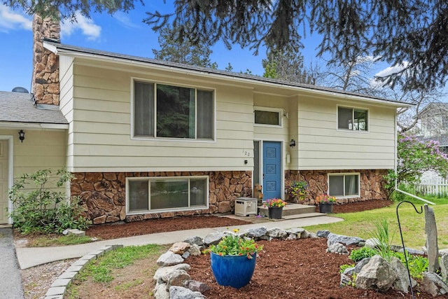 122 E Circle Dr, Newport, WA 99156 - view of front of property with a chimney, stone siding, and a front lawn